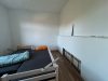 Geräumige, helle 4-Zimmer-Wohnung mit EBK in Ostritz - Schlafzimmer mit Betten